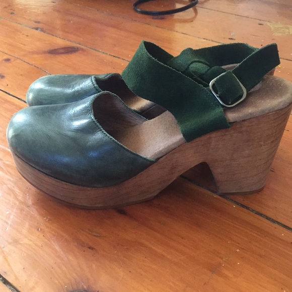 green wooden clogs